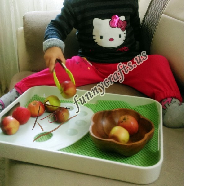 apple _transfer_ with_ tongs